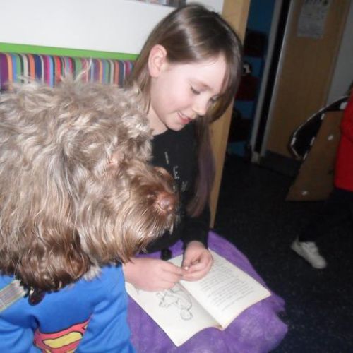 Alfie reading with children during World Book Day 2023